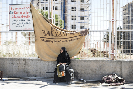 Syrian refugees (mainly from Aleppo and Idlib) entering Turkey in Kilis. Most of them will live in refugee camp. September 8, 2017; Kilis, Turkey.のeditorial素材