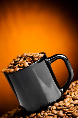 Cup filled with coffee beansの写真素材