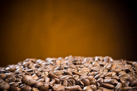 Brown coffee beans, close-up of coffee beans for background の写真素材