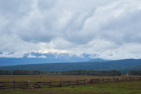 Snowy Peaks High in the Cloudsの写真素材