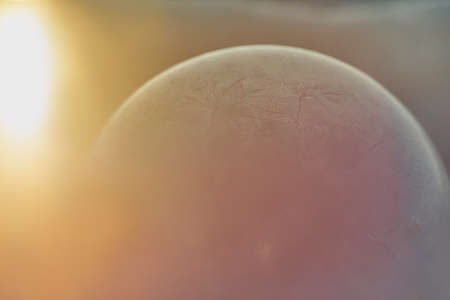 Winter textures on a frozen bubble on a winter dayの写真素材