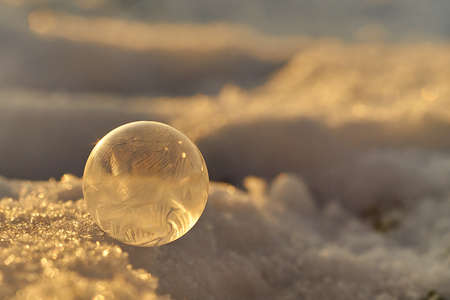 Small frozen bubble closeup on a winter day in the country sideの写真素材