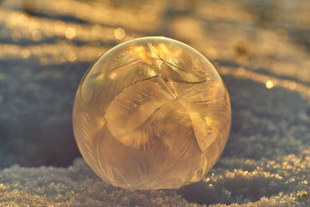 Frozen bubble closeup shot against the setting sun