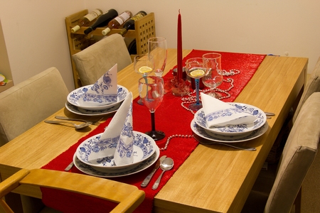 Christmas Dinner Table with red candleの写真素材