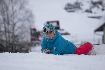 Beautiful snowboarder resting before riding.Photo taken on: 04/02/2015のeditorial素材