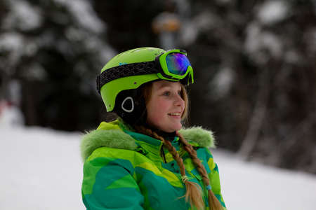 Beautiful snowboarder resting before riding.Photo taken on: 04/02/2015のeditorial素材