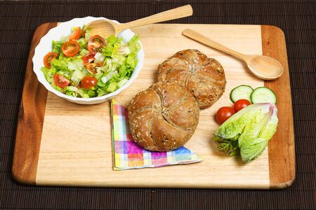 Healthy light dinner served on natural materials.の写真素材