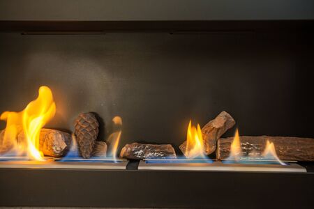 Modern indoor fireplace on biofuel (closeup).の写真素材