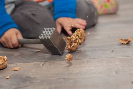 Crack a walnut (closeup, motion shot, Shallow DOF).の写真素材