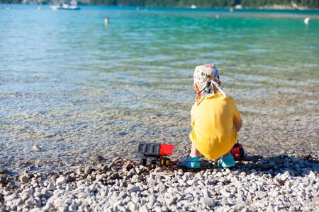 Cute, little boy playing on the beach.の写真素材