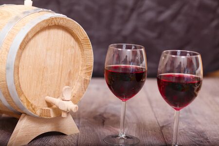 Still life with red wine and wooden cask (Shallow DOF).の写真素材