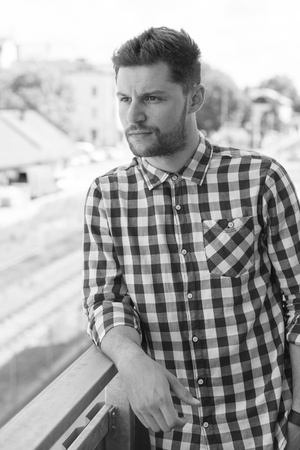 Portrait of a confident man in a plaid shirt.の写真素材