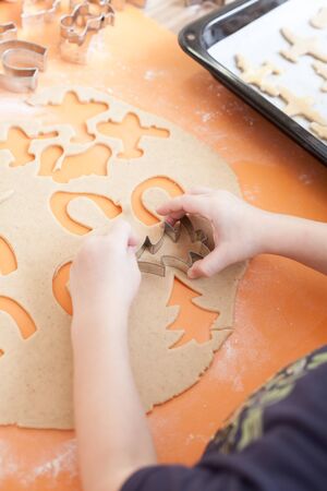 Baking Christmas cookies. Cutting out cookies - a Christmas tradition.