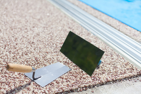 Coloured Concrete Around Pool with toolsの写真素材
