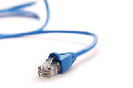 Closeup blue network cable over a white background