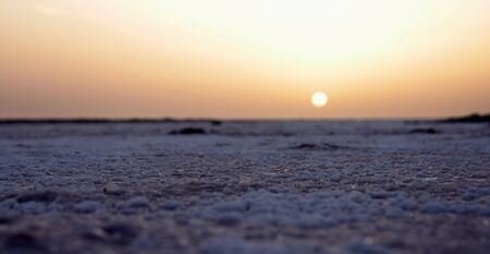 Sunrise in the desert salt, view from below the sun risesの写真素材