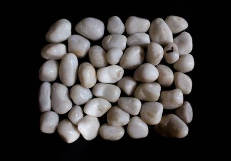 white royal sapphire rock pebbles cube photographed against a black background. - Imageの写真素材