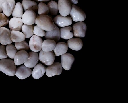 white royal sapphire rock pebbles stock photographed against a black background. - Imageの写真素材