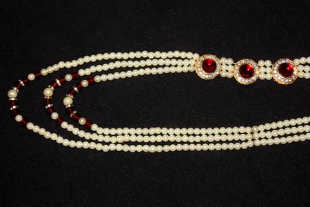 colorful Pearl strings abstract, necklace background row of pearl ornaments on black background- Imageの写真素材
