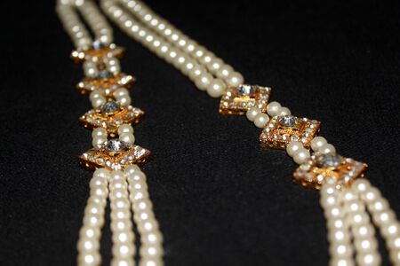 colorful Pearl strings abstract, necklace background row of pearl ornaments on black background- Imageの写真素材