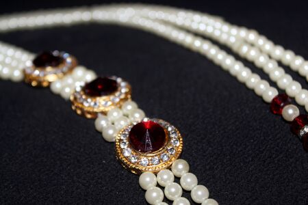 colorful Pearl strings abstract, necklace background row of pearl ornaments on black background- Imageの写真素材