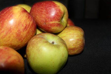 group of Colorful fruit pattern of fresh apples on black background- imageの写真素材