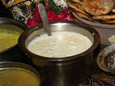 Kheer, Firni, pudding,boiling crusted milk served in steel bowl villagers style delicious street foodの写真素材