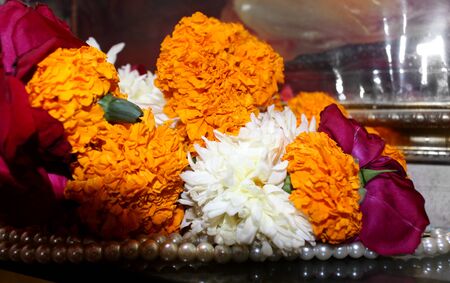 traditional Decorative background with marigold (tagetes), Chrysanthemum and rose flowers, isolated on blackの写真素材