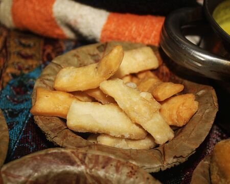 Shankarpali or shakkarpara Sweet Indian Food,instant source of energy served in disposable plate made from dry leaf with a typical Indian snack,Western Indiaの写真素材