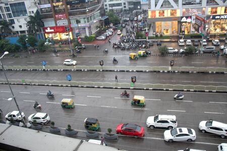 Top view of a developed city road traffic with vehicle, Indian town with business and financial centers and road with cars parking -Indore, Indiaの写真素材