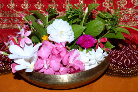 beautiful flowers in pot with rangoon criper, rose and pink oleander flower, decorative background, selective focus with blur.の写真素材