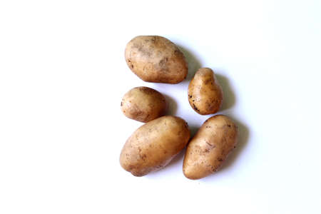 Fresh Organic Natural Potatoes over on white background, selective focus with blur.の写真素材
