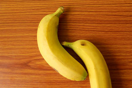 Fresh Yellow Banana Fruits puts on wood, selective focus with blurの写真素材