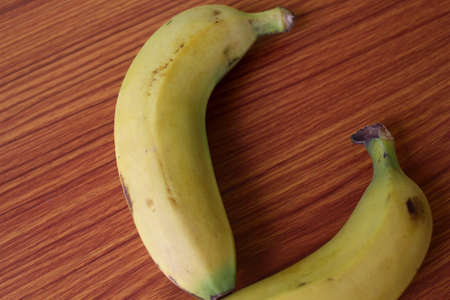 Fresh Yellow Banana Fruits puts on wood, selective focus with blurの写真素材