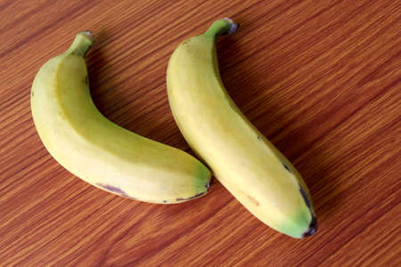 Fresh Yellow Banana Fruits puts on wood, selective focus with blurの写真素材