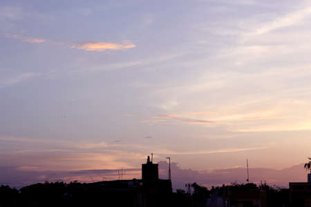 skyline urban landscape, sunset over a city, selective focus with blur.の写真素材