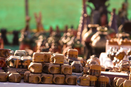 Traditional Indian handmade Items of Earthenware Or Ceramic at a Vendor Stall,decorative Sculpture Made with Earthen Mud, handcrafted traditional clay decoration toy in indian marketの写真素材
