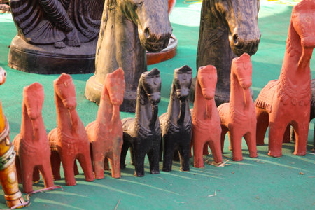 Traditional Indian handmade Items of Earthenware Or Ceramic at a Vendor Stall,decorative Sculpture Made with Earthen Mud, handcrafted traditional clay decoration toy in indian marketの写真素材