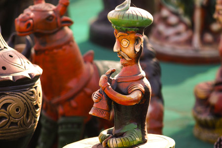 Traditional Indian handmade Items of Earthenware Or Ceramic at a Vendor Stall,decorative Sculpture Made with Earthen Mud, handcrafted traditional clay decoration toy in indian marketの写真素材