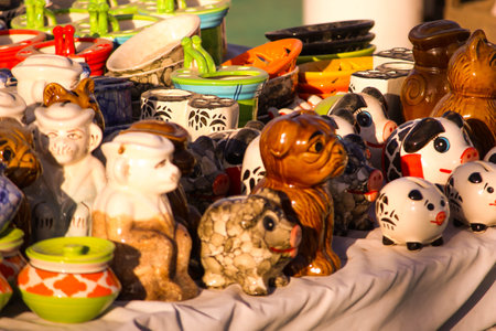 Traditional Indian handmade Items of Earthenware Or Ceramic at a Vendor Stall,decorative Sculpture Made with Earthen Mud, handcrafted traditional clay decoration toy in indian marketの写真素材