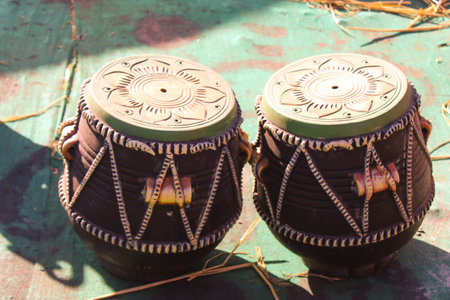 Close up of traditional tibetan drums on the ground.
