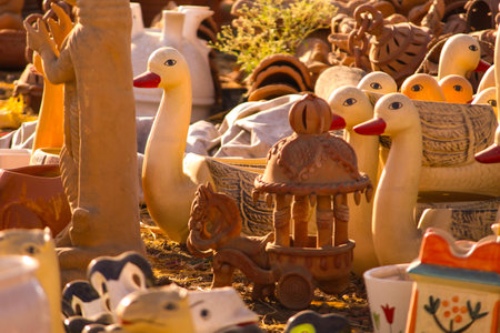 Traditional Indian handmade Items of Earthenware Or Ceramic at a Vendor Stall,decorative Sculpture Made with Earthen Mud, handcrafted traditional clay decoration toy in indian marketの写真素材