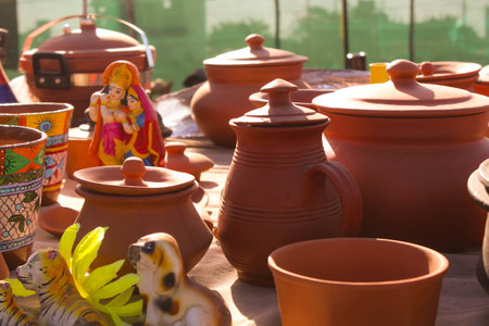 Traditional Indian handmade Items of Earthenware Or Ceramic at a Vendor Stall,decorative Sculpture Made with Earthen Mud, handcrafted traditional clay decoration toy in indian marketの写真素材