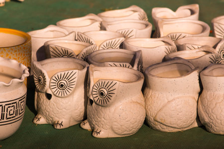 Traditional Indian handmade Items of Earthenware Or Ceramic at a Vendor Stall,decorative Sculpture Made with Earthen Mud, handcrafted traditional clay decoration toy in indian marketの写真素材