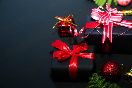 Deluxe holiday wishes concept. luxurious gift packages,Christmas and New Year background on black....