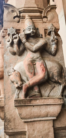 Carvings of ancient stone sculpture of indian god lord krishna at the 13th Century temple of rangnath swami in Indiaの写真素材