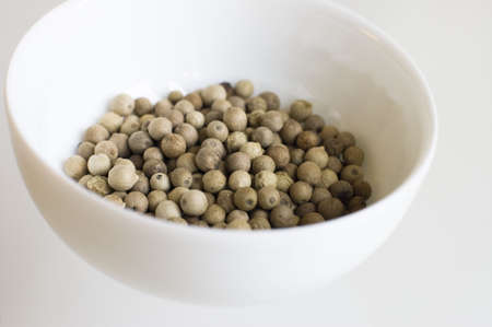 white pepper - spice in white bowlの写真素材