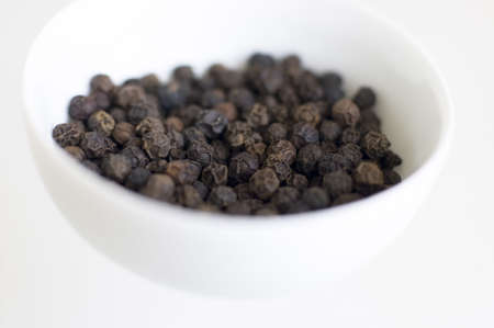 black pepper - spice in white bowl