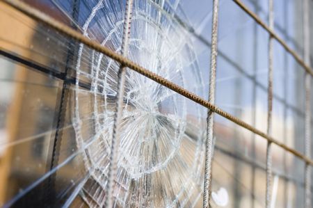 broken window with security steel bars