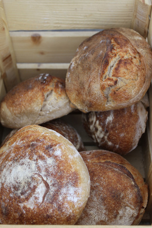 Fresh baked handmade bread in basket. Fresh baked homemade loaf in basket.の写真素材